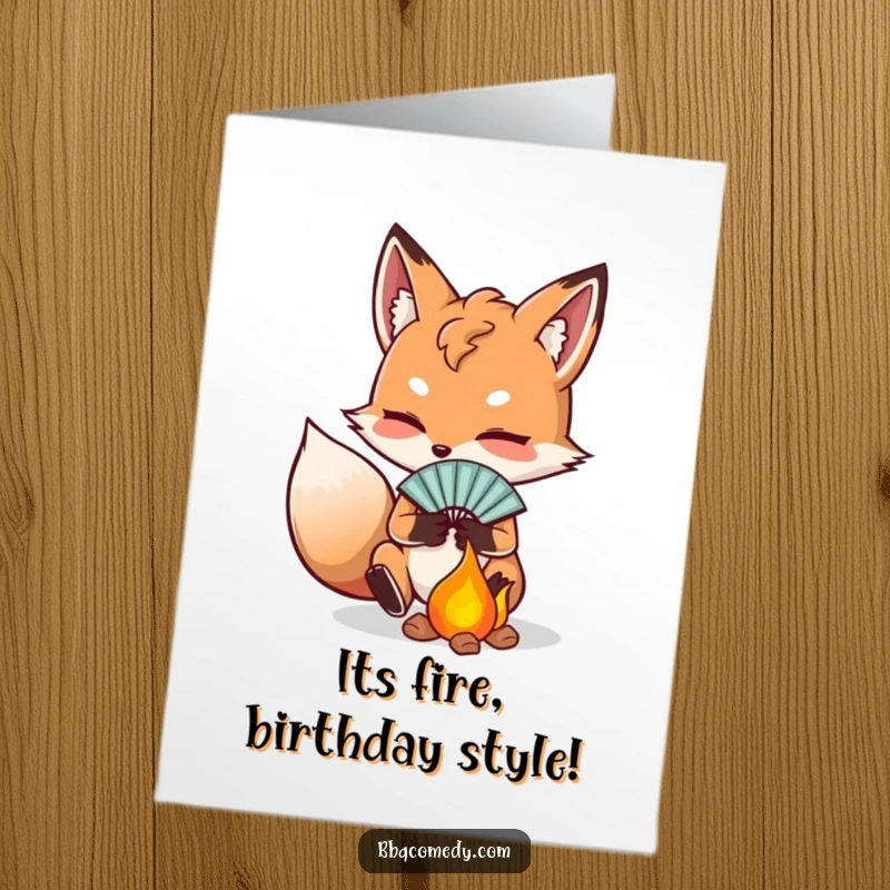 Funny free printable birthday card: a determined fox fanning embers with a small fan, igniting birthday wishes.